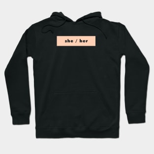 she / her - peach Hoodie